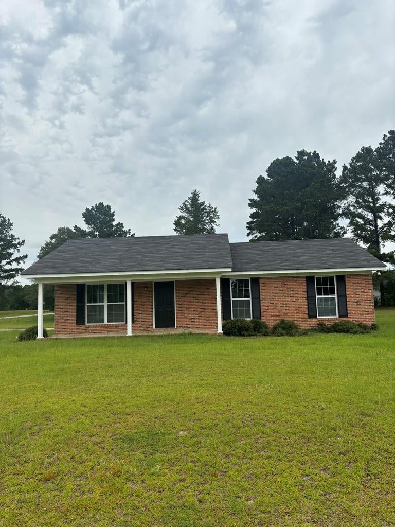 1000 E Gate Dr, Bainbridge, GA 39817 - view of front of house with a front yard and brick siding