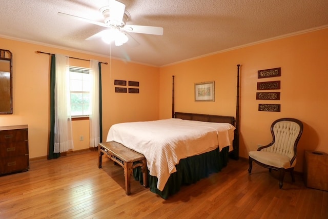 407 Lakeshore Dr, Bainbridge, GA 39819 - bedroom featuring light wood-type flooring, ornamental molding, a textured ceiling, and ceiling fan