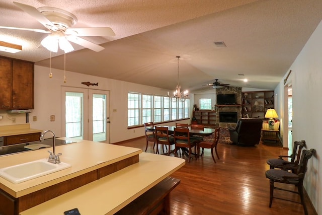 407 Lakeshore Dr, Bainbridge, GA 39819 - kitchen featuring dark wood-style flooring, lofted ceiling, open floor plan, ceiling fan, and a sink