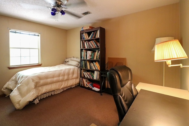 407 Lakeshore Dr, Bainbridge, GA 39819 - bedroom featuring visible vents, carpet flooring, ceiling fan, and wallpapered walls