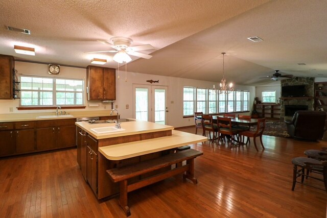 407 Lakeshore Dr, Bainbridge, GA 39819 - kitchen with a textured ceiling, a sink, ceiling fan with notable chandelier, and dark wood-type flooring