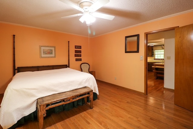 407 Lakeshore Dr, Bainbridge, GA 39819 - bedroom featuring crown molding, a textured ceiling, light wood-style flooring, and ceiling fan