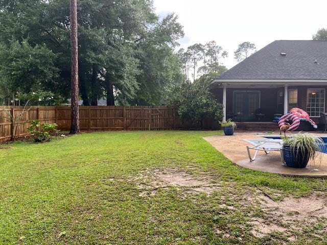 1002 Willis St, Bainbridge, GA 39819 - fenced backyard with a patio