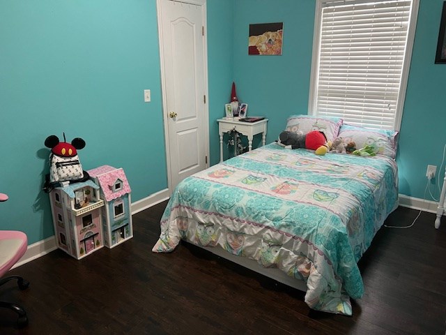 1002 Willis St, Bainbridge, GA 39819 - bedroom with baseboards and wood finished floors