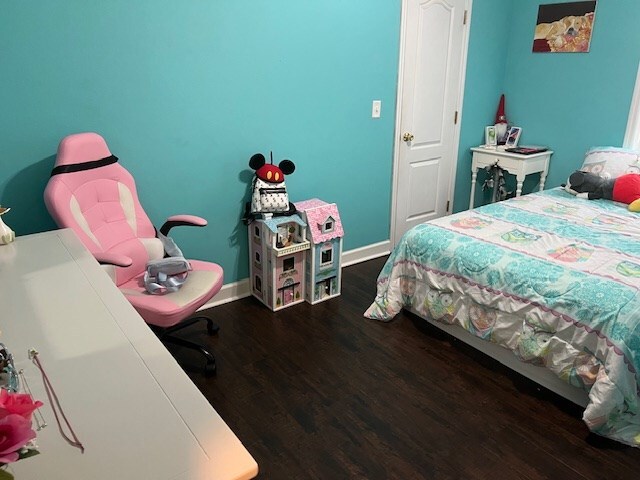 1002 Willis St, Bainbridge, GA 39819 - bedroom with wood finished floors and baseboards