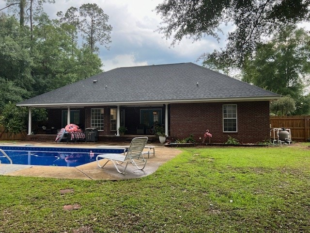 1002 Willis St, Bainbridge, GA 39819 - rear view of house with a patio, a shingled roof, and brick siding