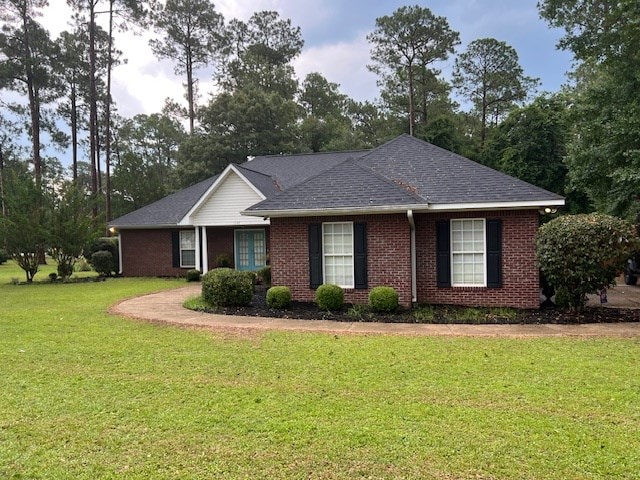 1002 Willis St, Bainbridge, GA 39819 - single story home featuring a front yard, brick siding, and roof with shingles