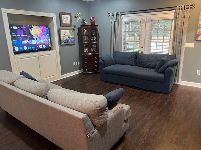 1002 Willis St, Bainbridge, GA 39819 - living room with baseboards and wood finished floors