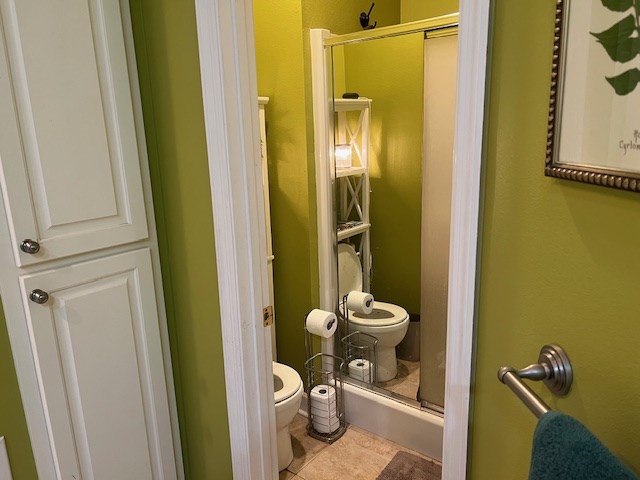 1002 Willis St, Bainbridge, GA 39819 - full bathroom with an enclosed shower and tile patterned floors