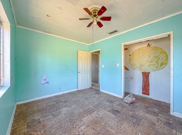 unfurnished bedroom with parquet floors, ceiling fan, and ornamental molding