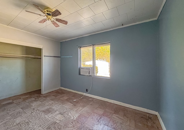 unfurnished bedroom featuring a closet, ceiling fan, crown molding, and light parquet flooring