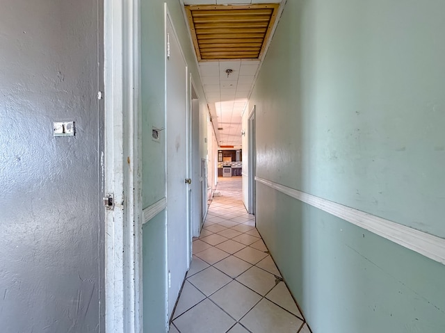 hallway featuring light tile patterned floors