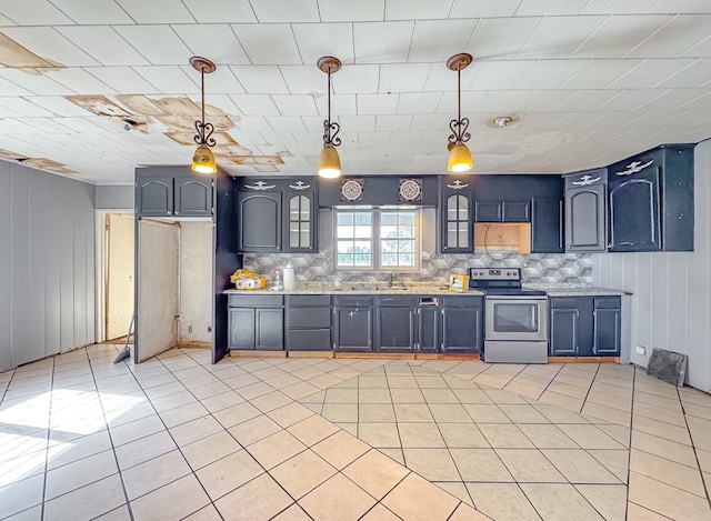 kitchen with decorative light fixtures, stainless steel range with electric cooktop, light tile patterned floors, and sink