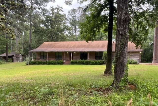 267 Providence Rd, Whigham, GA 39897 - ranch-style home with a front lawn and covered porch