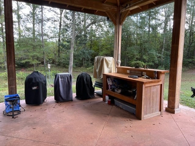 view of patio featuring a grill