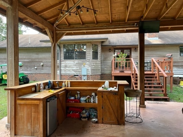 view of patio with a bar