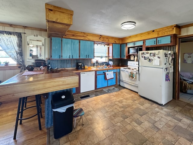 810 Three Notch Rd, Colquitt, GA 39837 - kitchen featuring a sink, visible vents, white appliances, and stone finish floor