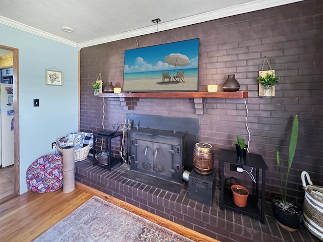 810 Three Notch Rd, Colquitt, GA 39837 - living room featuring brick wall, wood finished floors, and crown molding