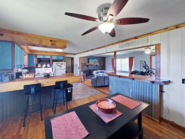 810 Three Notch Rd, Colquitt, GA 39837 - dining area featuring a textured ceiling, wood finished floors, and ceiling fan