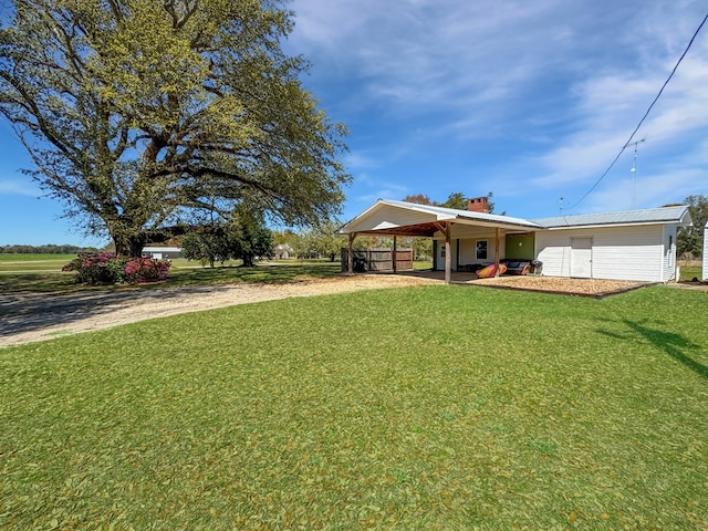 810 Three Notch Rd, Colquitt, GA 39837 - view of front of house featuring driveway, an attached carport, a chimney, and a front yard