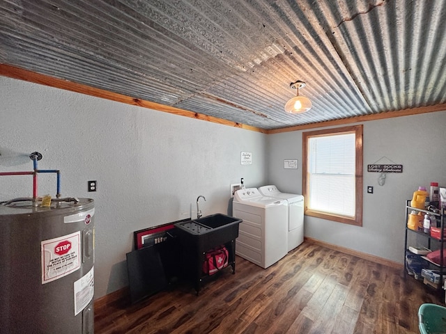 810 Three Notch Rd, Colquitt, GA 39837 - laundry room featuring washer and dryer, electric water heater, wood finished floors, baseboards, and laundry area