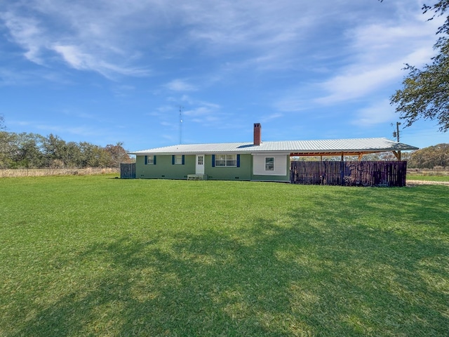 810 Three Notch Rd, Colquitt, GA 39837 - back of property featuring a lawn, a chimney, and metal roof