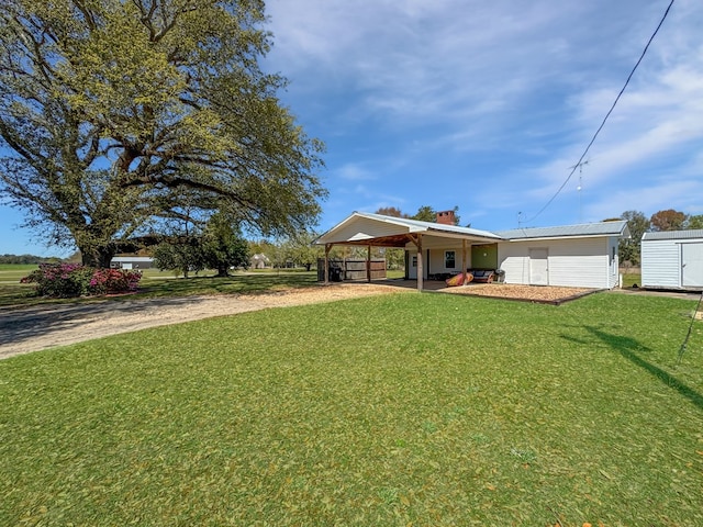810 Three Notch Rd, Colquitt, GA 39837 - view of front facade with an attached carport, dirt driveway, a shed, a front yard, and an outbuilding