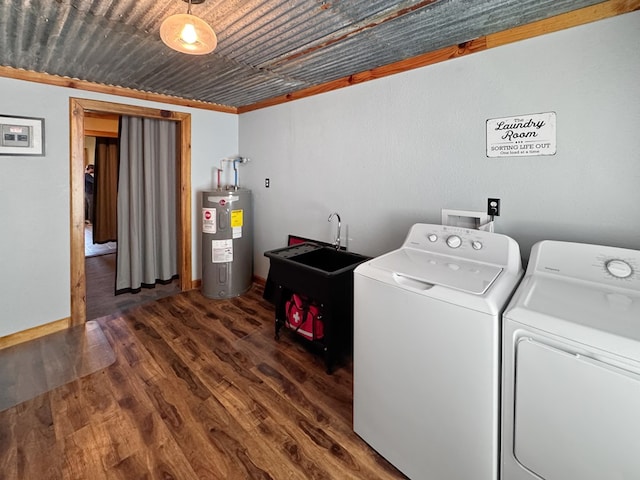 810 Three Notch Rd, Colquitt, GA 39837 - washroom featuring baseboards, washing machine and dryer, water heater, laundry area, and wood finished floors