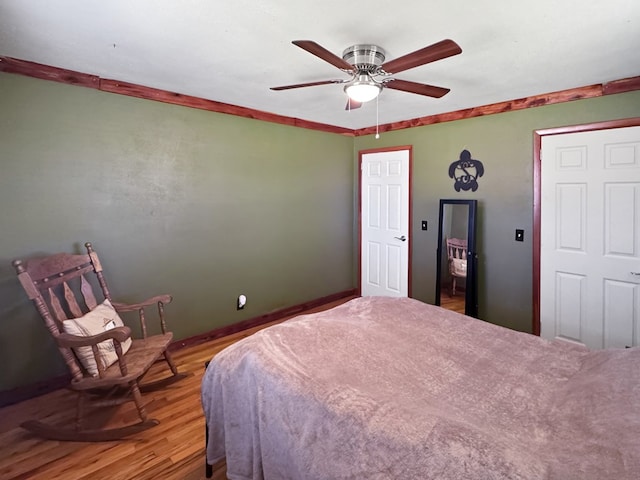 810 Three Notch Rd, Colquitt, GA 39837 - bedroom featuring ornamental molding, ceiling fan, and wood finished floors