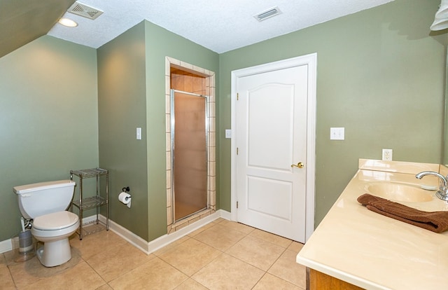 bathroom featuring vanity, tile patterned flooring, toilet, a textured ceiling, and an enclosed shower