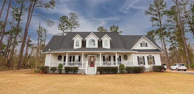 view of front of house with a porch and a front yard