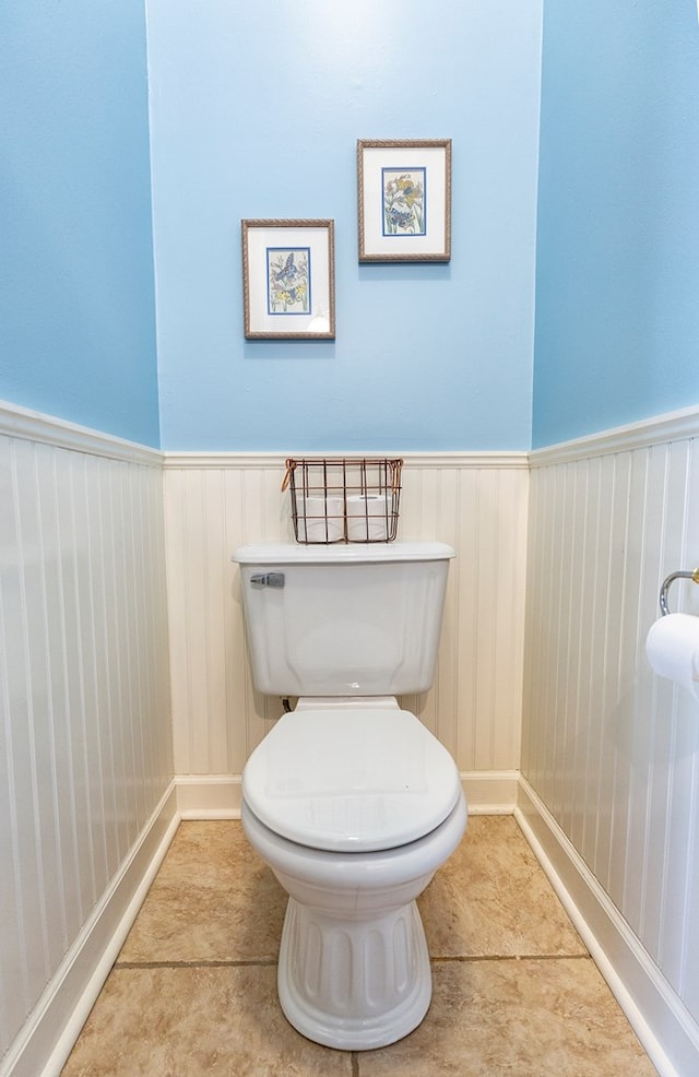 bathroom featuring tile patterned flooring and toilet