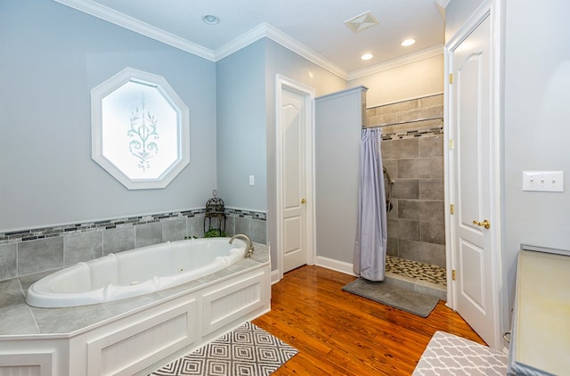 bathroom featuring hardwood / wood-style flooring, ornamental molding, and plus walk in shower