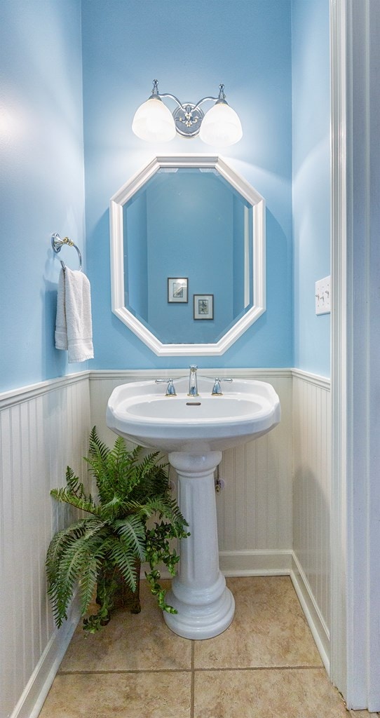 bathroom with tile patterned floors