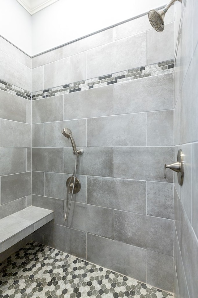 bathroom with a tile shower