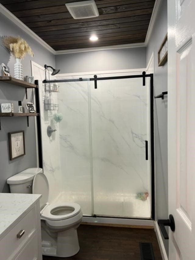 1104 Old Thomasville Rd, Cairo, GA 39828 - full bath featuring wood ceiling, ornamental molding, vanity, a marble finish shower, and wood finished floors