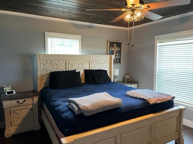 1104 Old Thomasville Rd, Cairo, GA 39828 - bedroom with dark wood finished floors, ornamental molding, and a ceiling fan