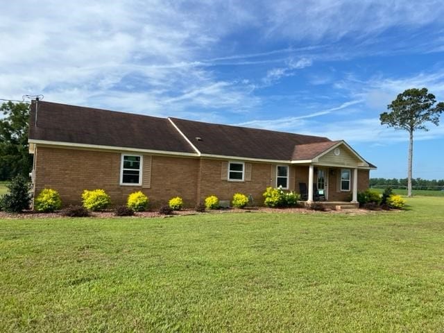 1104 Old Thomasville Rd, Cairo, GA 39828 - ranch-style house featuring a front yard, a porch, and brick siding