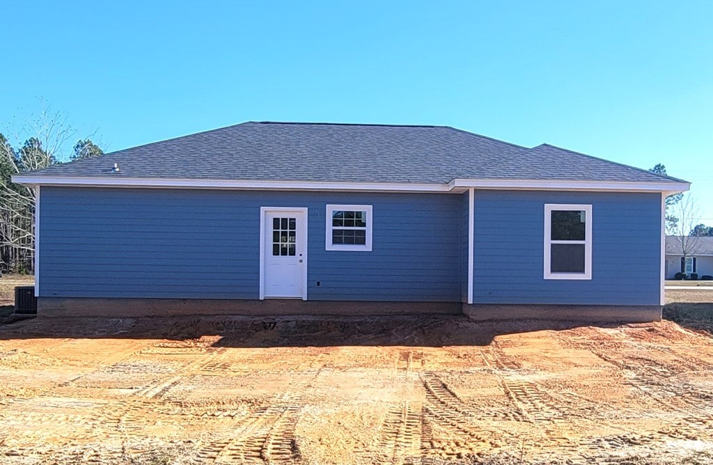 back of house featuring central air condition unit