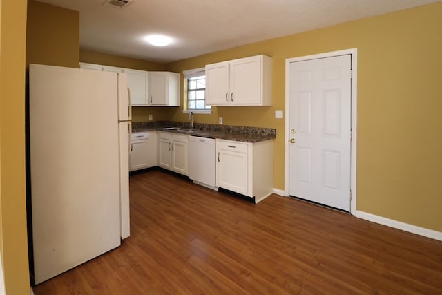 kitchen with baseboards, dark wood finished floors, white appliances, white cabinetry, and a sink