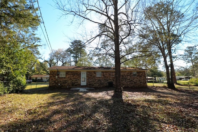 back of house with fence