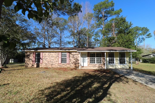 single story home featuring brick siding and a front lawn