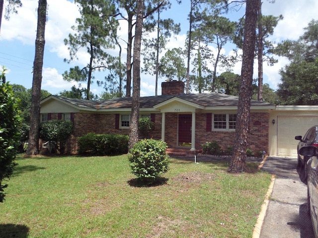 701 Collier St, Bainbridge, GA 39819 - single story home featuring a chimney, a front lawn, an attached garage, and brick siding