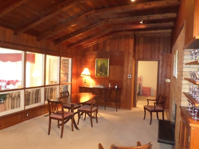701 Collier St, Bainbridge, GA 39819 - carpeted dining area featuring vaulted ceiling and wood walls