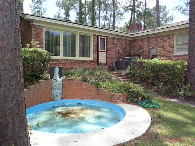 701 Collier St, Bainbridge, GA 39819 - exterior space with brick siding and a jacuzzi