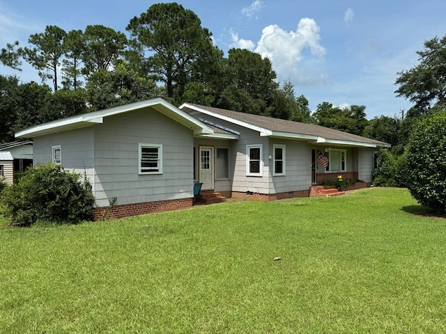 ranch-style house featuring a front lawn