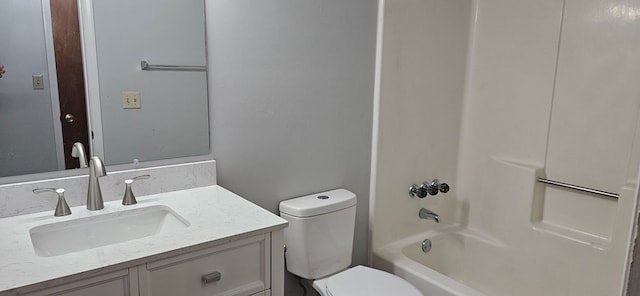 full bathroom featuring toilet, vanity, and washtub / shower combination