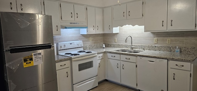 kitchen featuring a sink, under cabinet range hood, white appliances, white cabinets, and decorative backsplash