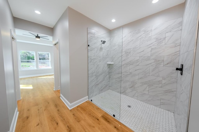 bathroom with recessed lighting, a ceiling fan, wood finished floors, baseboards, and walk in shower