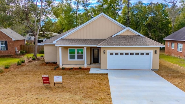 view of front facade featuring a garage, fence, concrete driveway, and roof with shingles